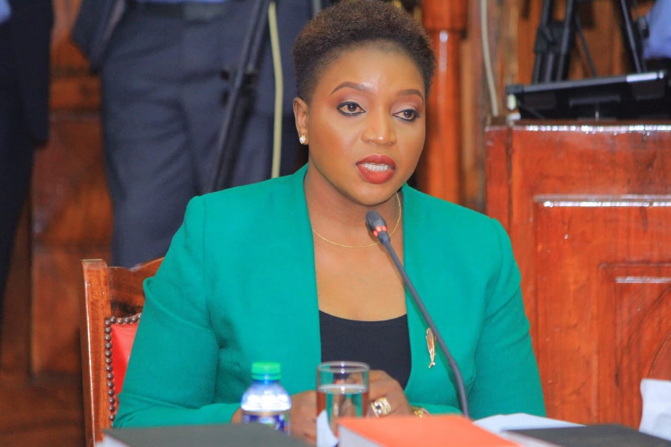 A close up of Health CS Susan Wafula sitting on a chair