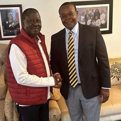 Governor Otuoma shaking hands with ODM leader Raila Odinga